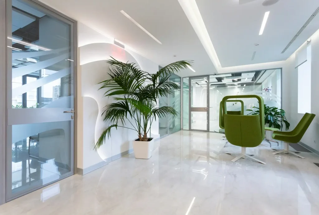Bright clinic lobby with plants and seating