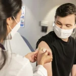 Young man receiving a vaccine