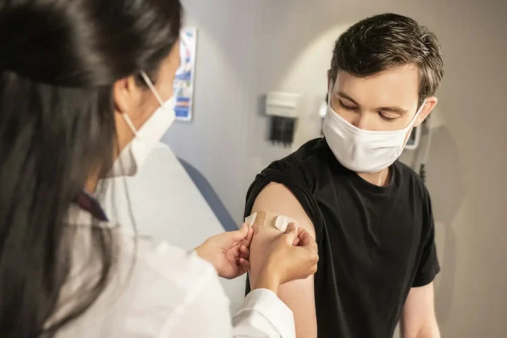 Young man receiving a vaccine